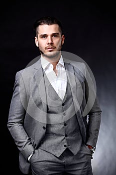 Portrait of handsome stylish man in elegant suit