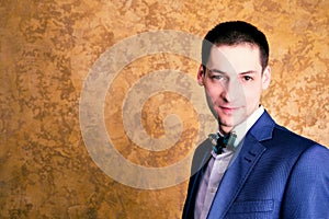 Portrait of handsome stylish man in elegant suit