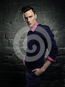 Portrait of a handsome stylish man posing in photostudio