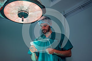 Portrait of a handsome surgeon work in operating room