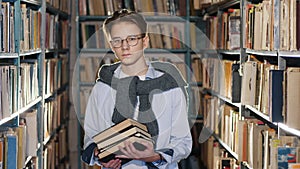 Portrait of handsome teenage boy in the library