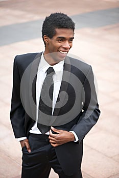 Portrait of a handsome young african american businessman smiling outside