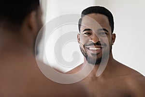 Portrait of handsome young African American man with stylish stubble