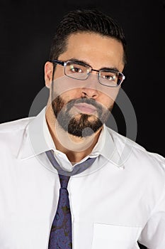 Portrait of handsome young bearded man with glasses in formal wear. Optical male model