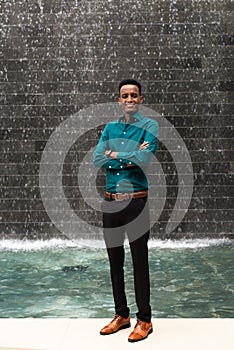 Portrait of handsome young black man outdoors in city