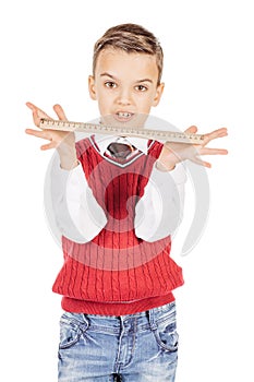 Portrait handsome young boy with a ruler on white background.