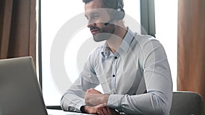 Portrait of handsome young businessman in headset