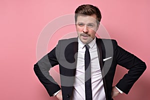 Portrait of a handsome young businessman with mustache in suit