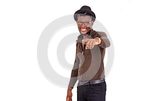 Portrait of a handsome young businessman pointing finger, smiling