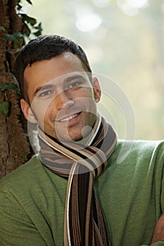 Portrait of handsome young man in autumn park