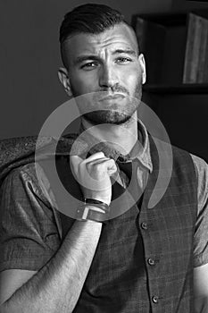 Portrait of a handsome young man. Brazen brutal look. Stylish fashionable man close-up.