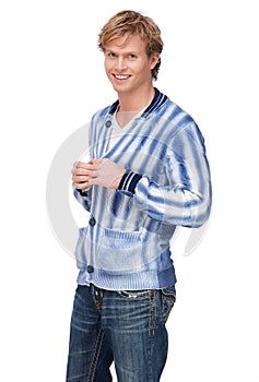 Handsome Young Man Buttoning his Shirt