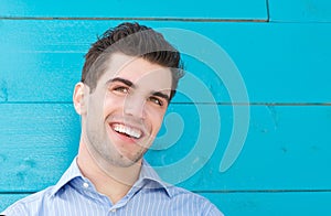 Portrait of a handsome young man smiling and looking away