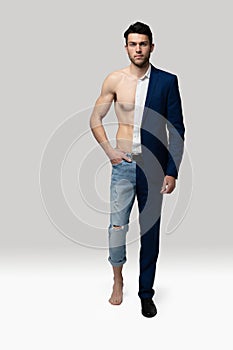 Portrait of a handsome young man in suit and shirtless muscular male model against white background