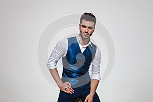 Portrait of handsome young man wearing a blue gilet