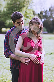 Portrait of a happily married couple expecting a baby