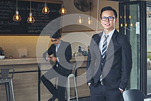 Portrait happiness businessman smiling face confident leader manager in modern city. Asian man handsome success look at camera