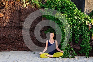 Portrait of happiness young woman practicing yoga on outdoors.Yoga and relax concept. Beautiful girl practice asana