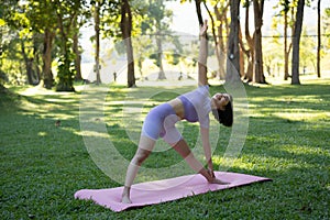 Portrait of happiness young woman practicing yoga on outdoors.Yoga and relax concept. Beautiful girl practice asana