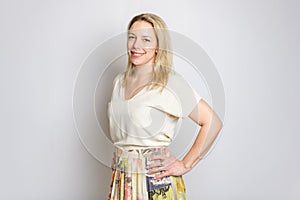 Portrait of happy 40 woman over white background