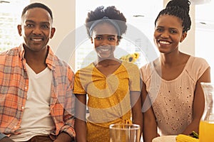 Happy African American family smiling at camera