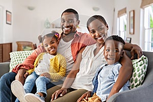 Portrait of happy african american family with son and daughter smiling