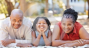 Portrait happy african american family of three spending quality time together in the park during summer. Grandparents