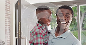 Portrait of happy african american father with son