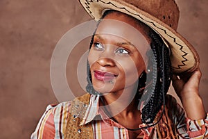 Portrait of happy african american girl wearing cowboy hat
