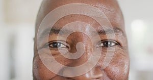 Portrait of happy african american man looking at camera and smiling