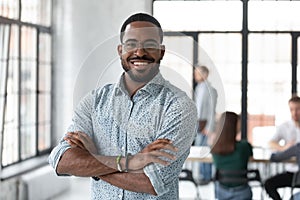 Portrait of happy African American small business owner photo