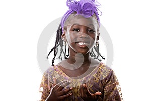 Portrait of a happy African little girl in purple costume.Isolated