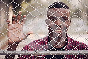 Portrait of happy african american young man on sportswear,red shirt . Black men model street concept..