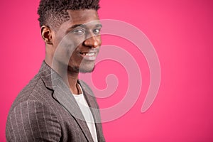 Portrait of happy Africanamerican male in grey suit jacket