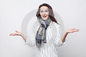 Portrait of happy amazed beautiful brunette woman in white strip