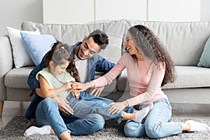 Portrait Of Happy Arab Family Spending Time Together At Home