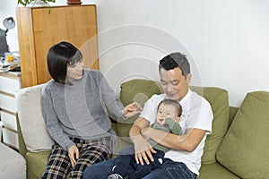 Portrait of a happy asain family in living room