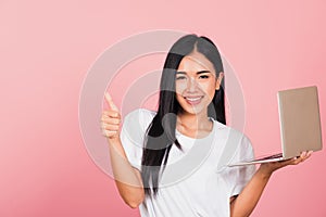 woman confident smiling holding using laptop computer and showing thumb up