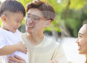 Portrait Of Happy Asian Family In the park