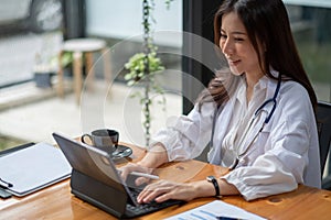 Portrait happy asian woman doctor, Telemedicine concept. Asian female doctor talking with patient using laptop online