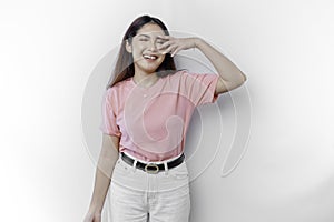 A portrait of a happy Asian woman wearing a pink blouse isolated by white background