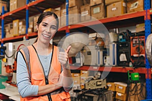portrait happy asian woman worker in warehouse cargo factory products storage shelf background