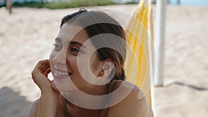 Portrait happy beach girl enjoying summer vacation. Beautiful woman rest hammock