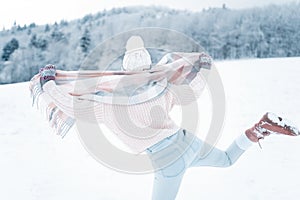 Portrait of a happy and beautiful brunette girl in the snow