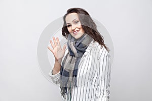 Portrait of happy beautiful brunette woman in white striped jack