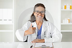 Portrait of happy beautiful Caucasian mature woman doctor