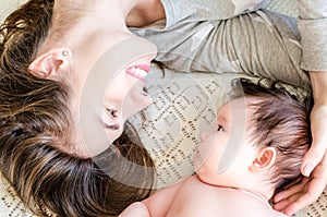 Portrait of happy beautiful mother and cute newborn baby girl