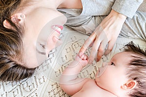 Portrait of happy beautiful mother and cute newborn baby girl