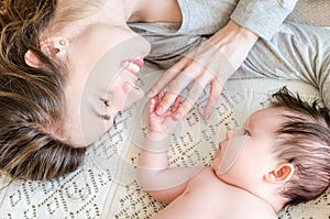 Portrait of happy beautiful mother and cute newborn baby girl