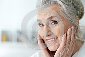 Portrait of happy beautiful senior woman posing